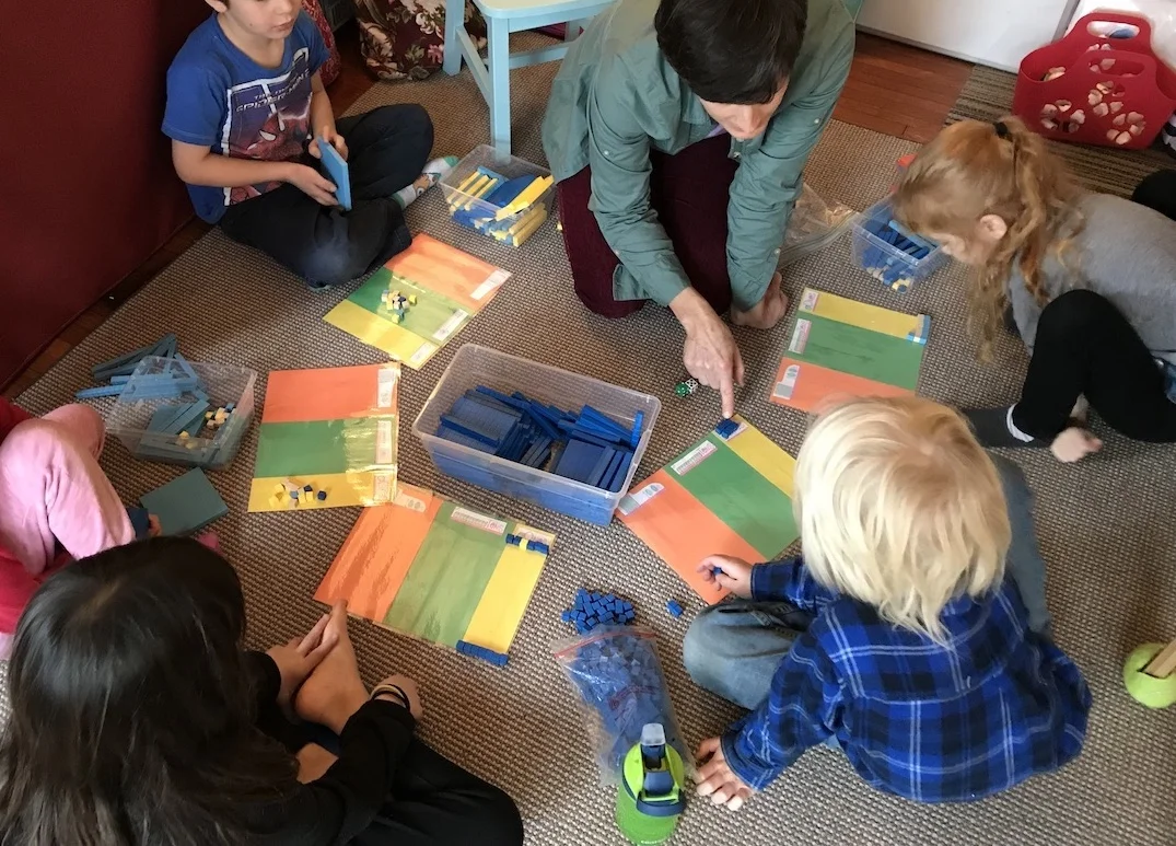 A circle of Chickadees playing with math concepts.