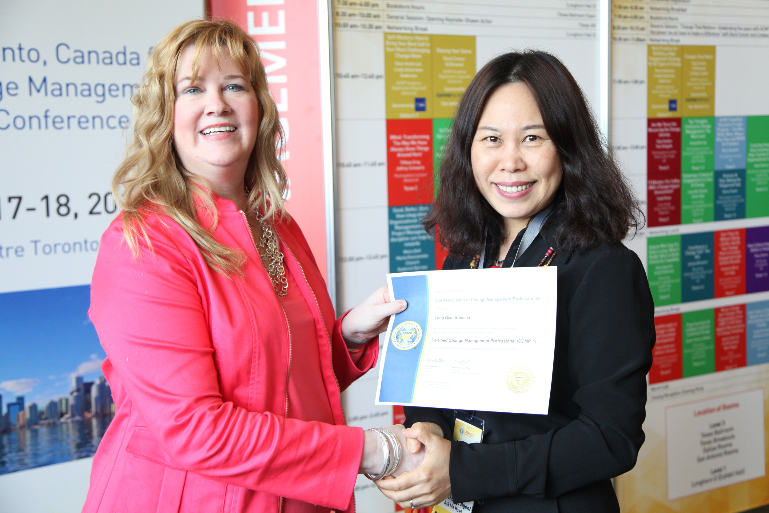 ACMP Board Member Mary Sylvester congratulating Annie on graduation