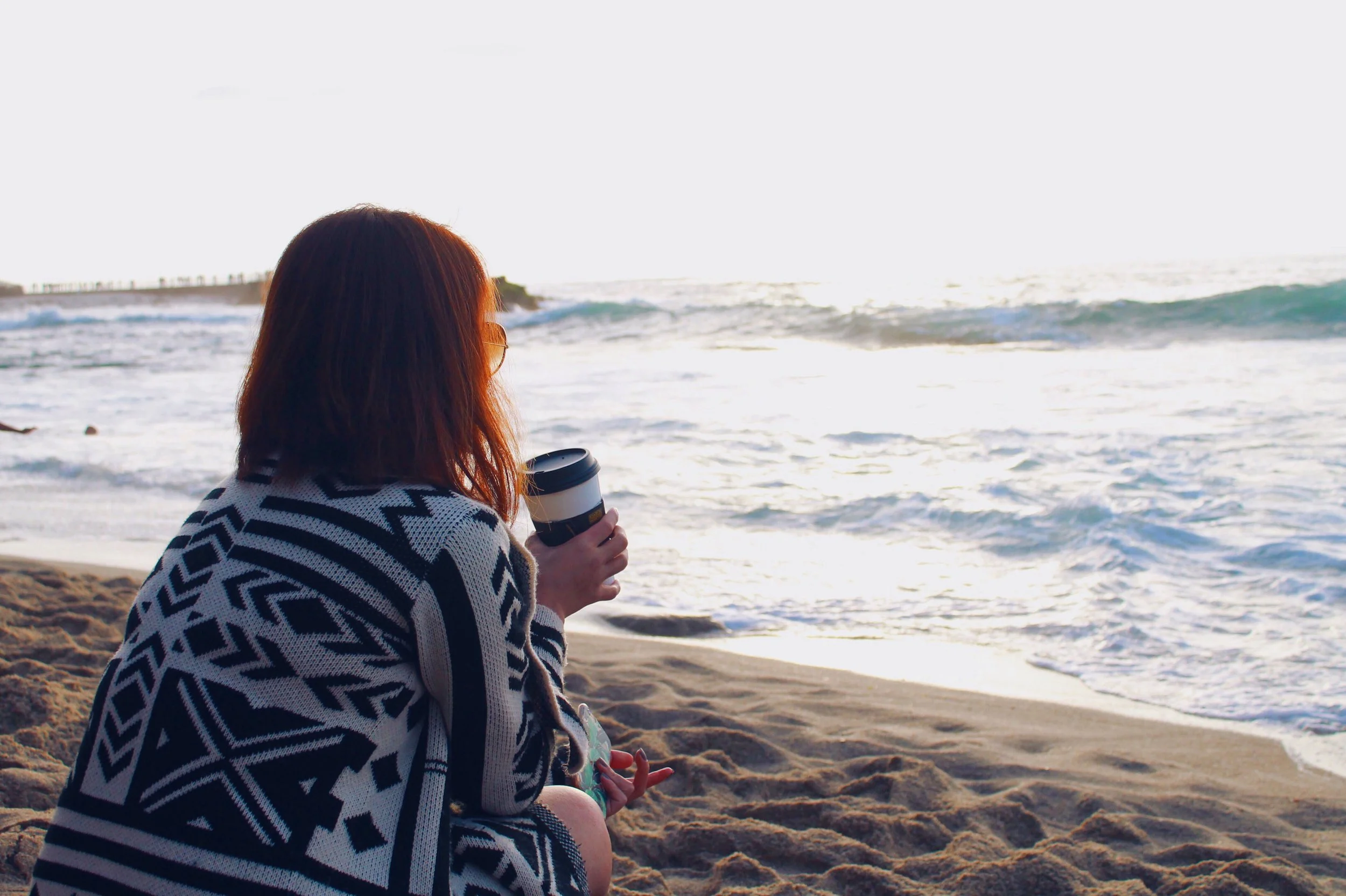 A SIDE OF BEACH WITH COFFEE