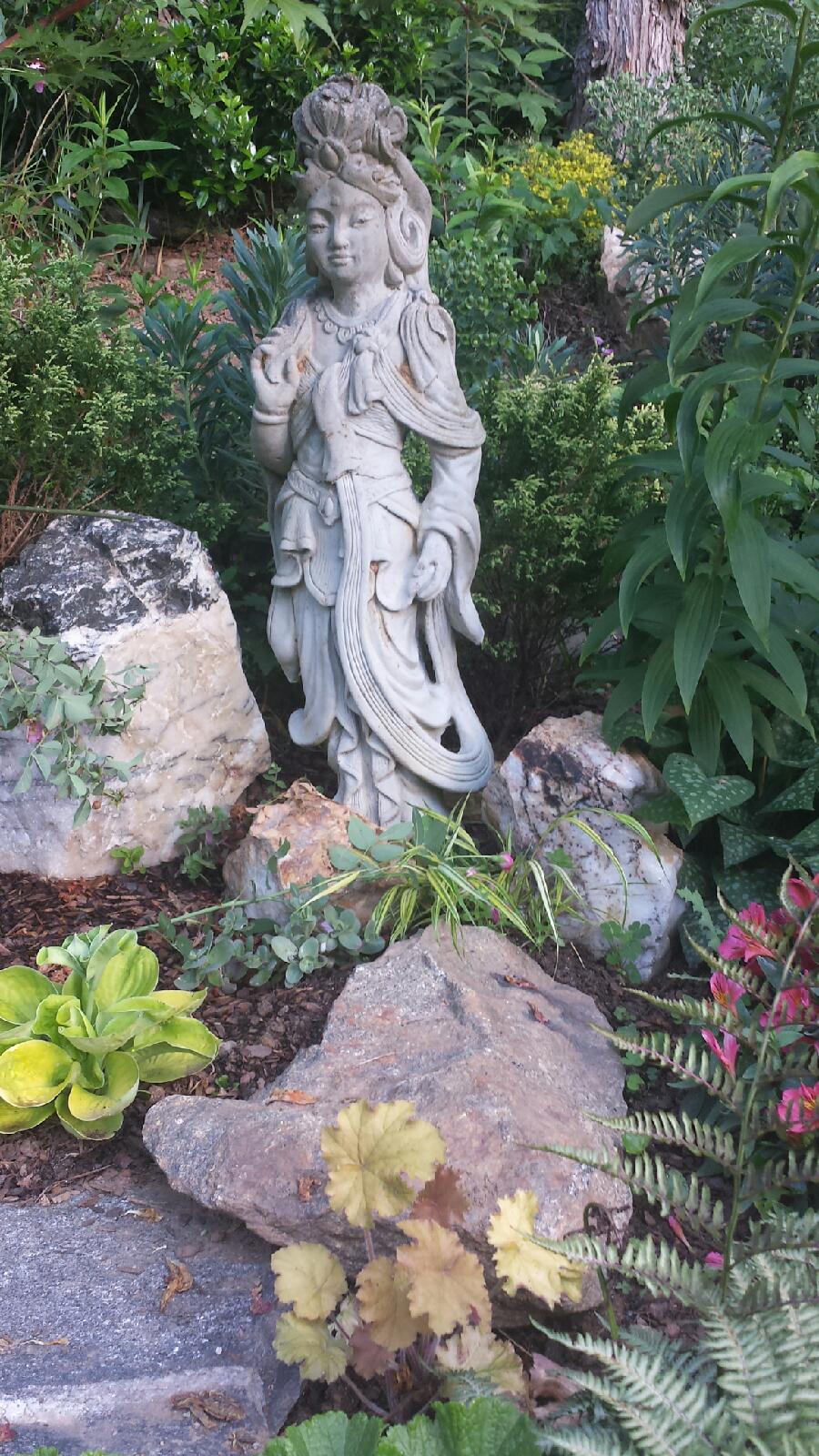 Cynthia added large stones and art work to balance out her love of flowers, and anchor the garden.&nbsp;An easy fix for areas in our gardens that lack structure.