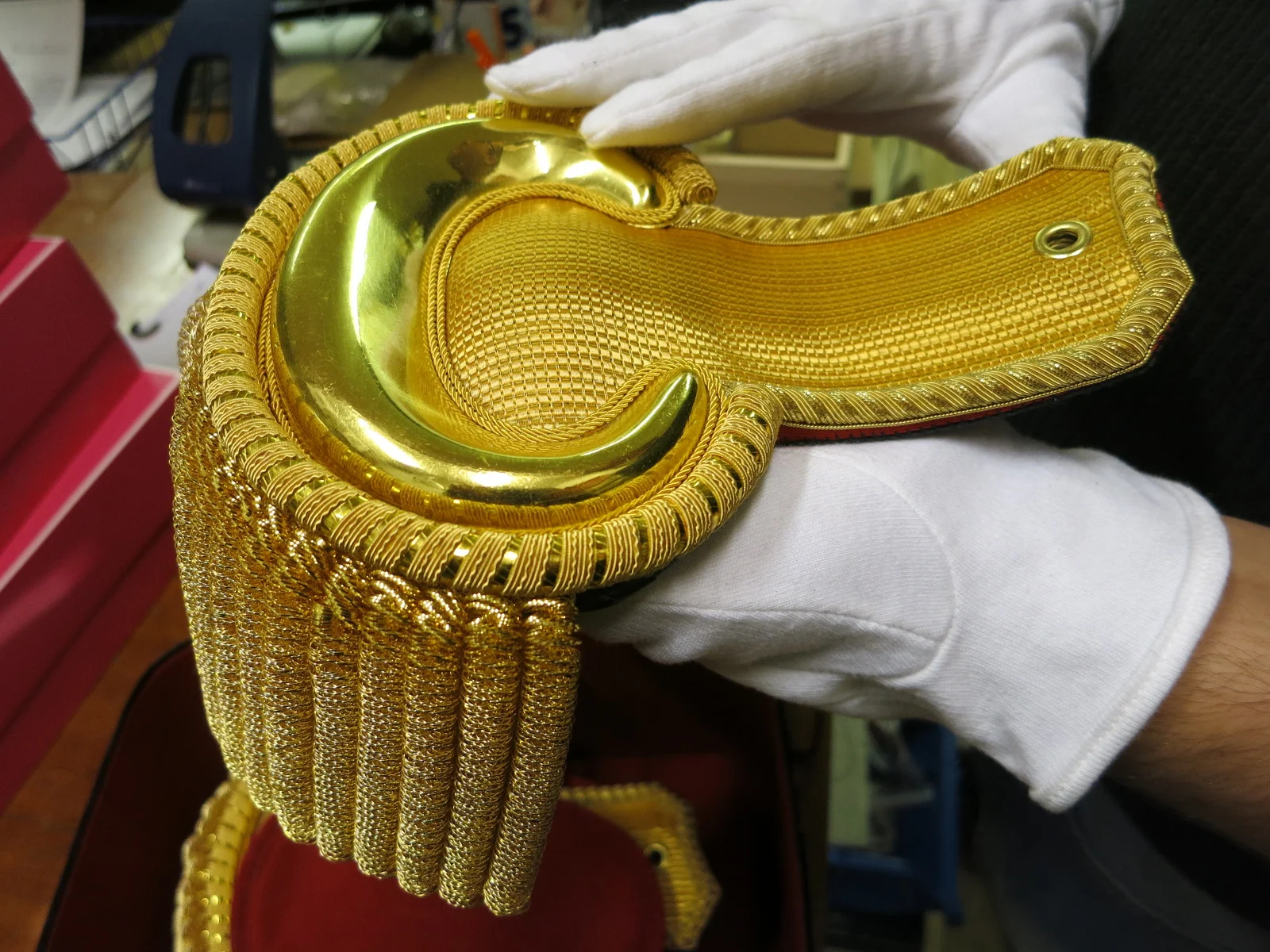 A metal thread embroidered epaulette