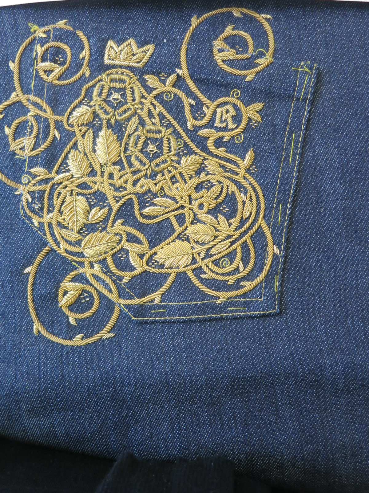 A metal thread embroidered sample at Hand & Lock
