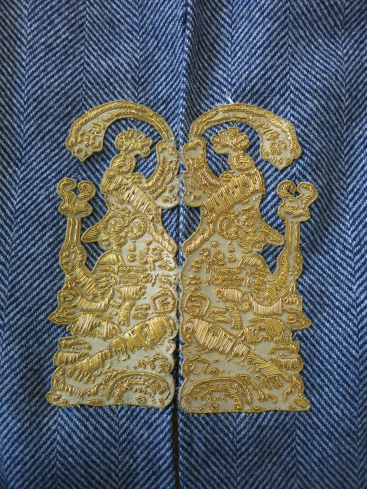 A metal thread embroidered sample at Hand & Lock