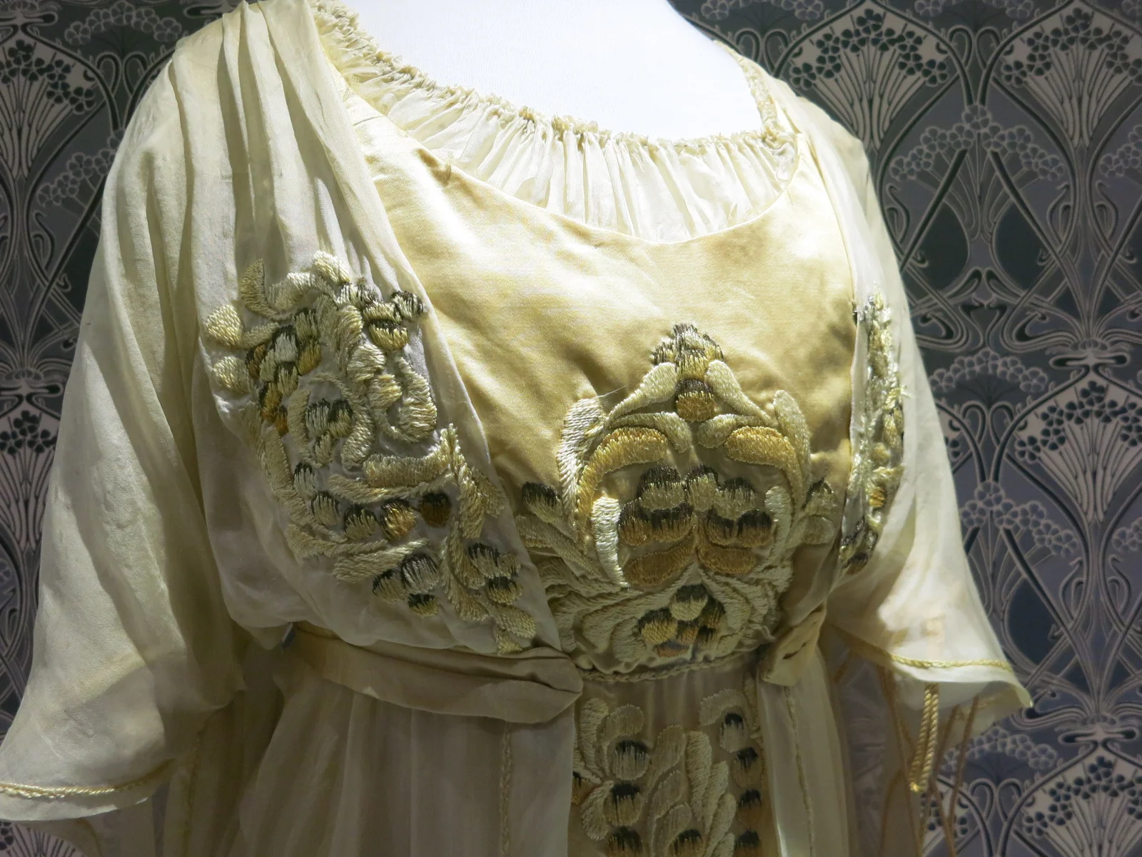 Liberty in Fashion exhibition at the Fashion & Textile Museum, Bermondsey, London 2015. A detail of the embroidery on the 1910 afternoon dress.
