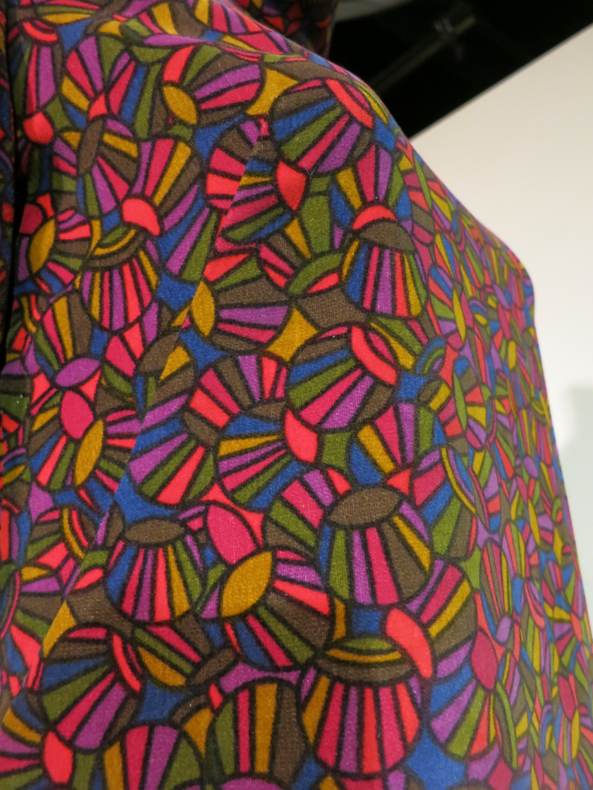 Liberty in Fashion exhibition at the Fashion & Textile Museum, Bermondsey, London 2015. This print was designed by Richard Nevill. The dress was made for 'Through the Looking Glass, the most popular fashion shop in Liverpool, UK