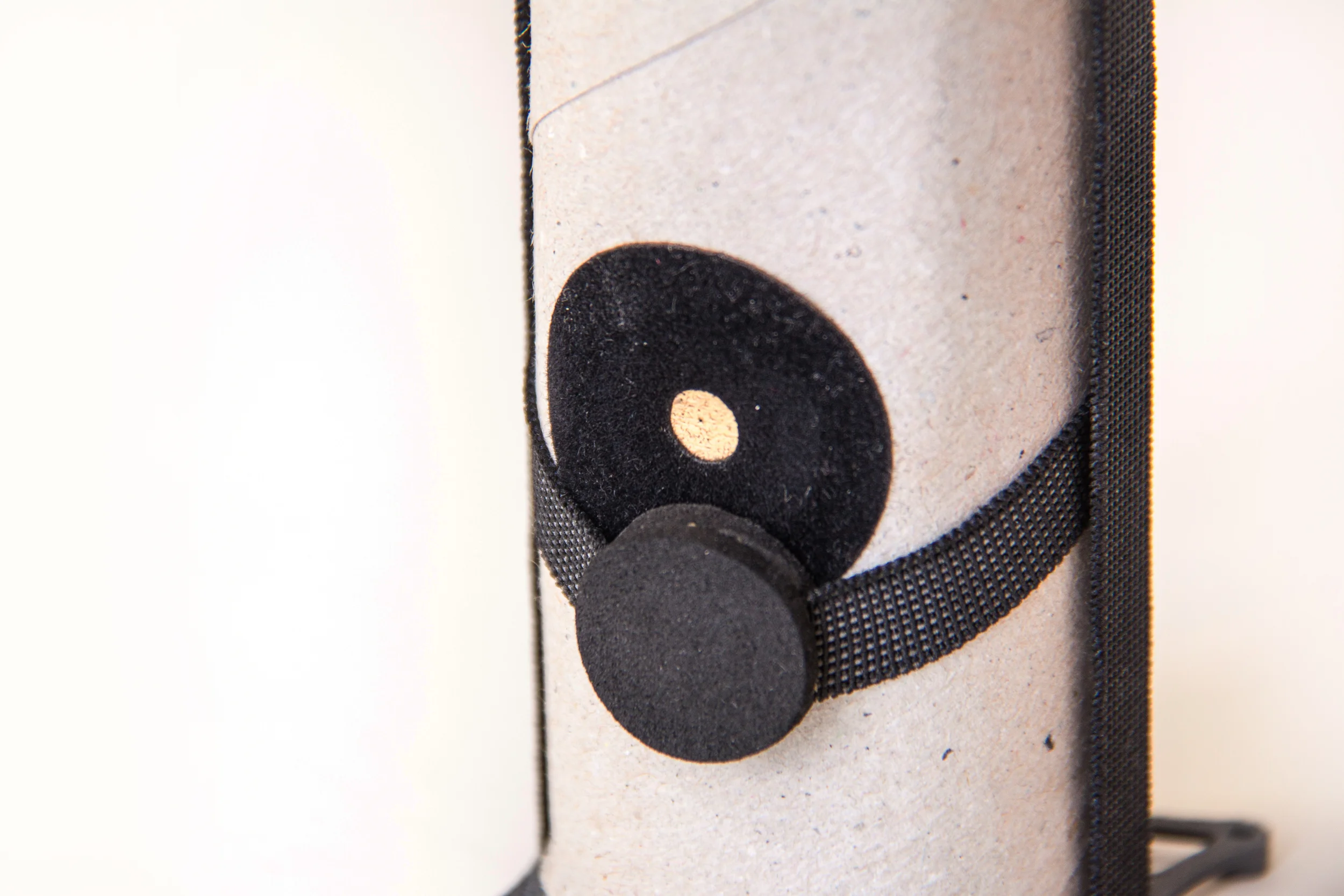  The sticker comes with a pinhole and is places on another bigger hole in the TP roll.&nbsp; 