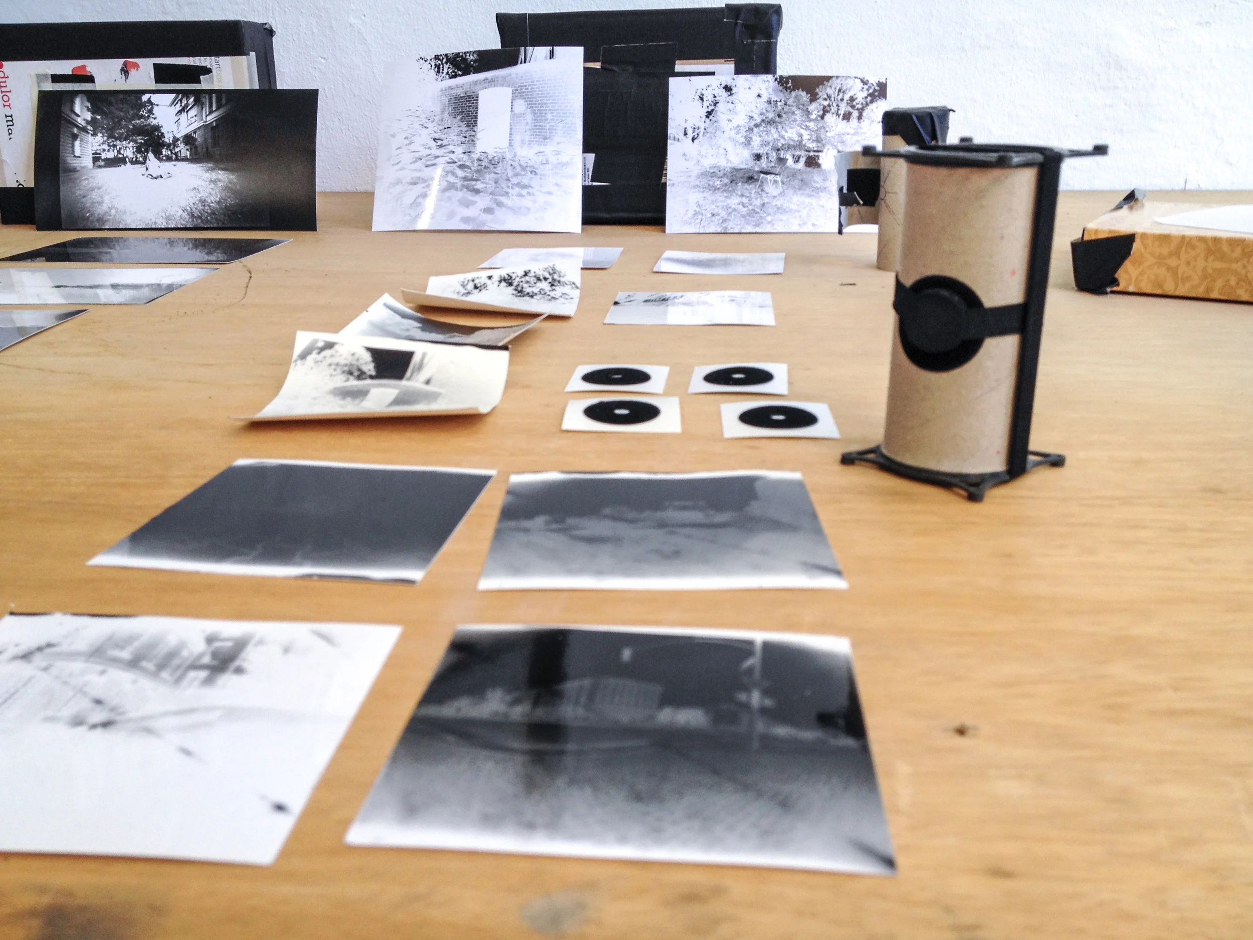  The negatives and self-made pinhole stickers. 