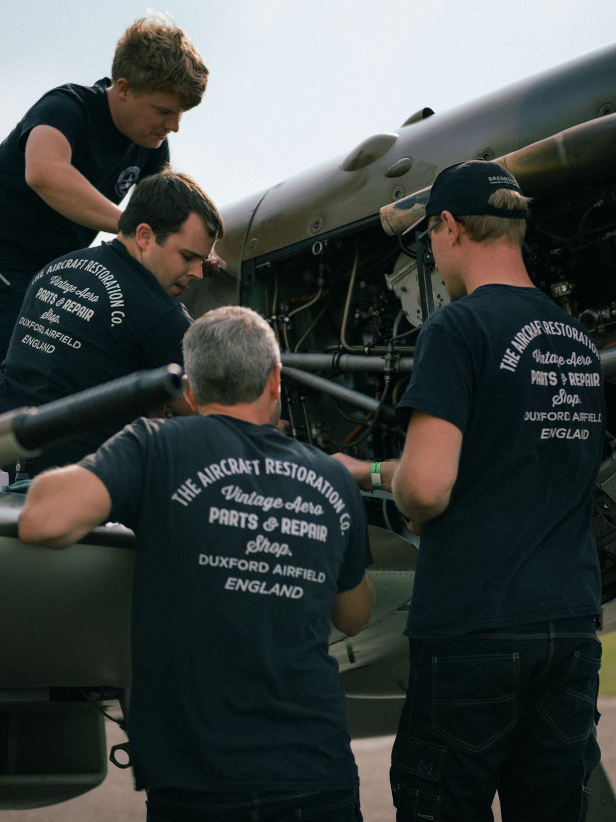 AircraftRestorationCo_Spitfire-Team-Engineering-Duxford-Airfield_by-GeorgeLewisRomain.jpg