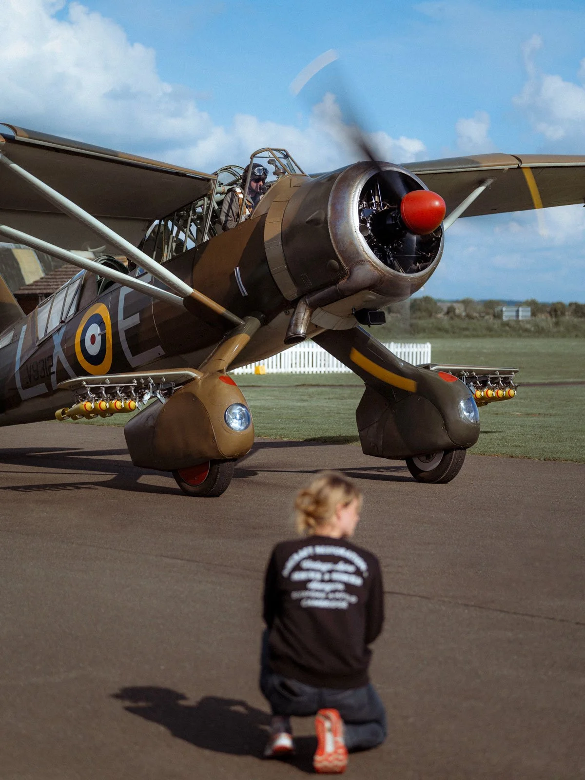 Westland Lysander V9312 outside ARCo Hangar at Duxford Airfield, Engineer in foreground.