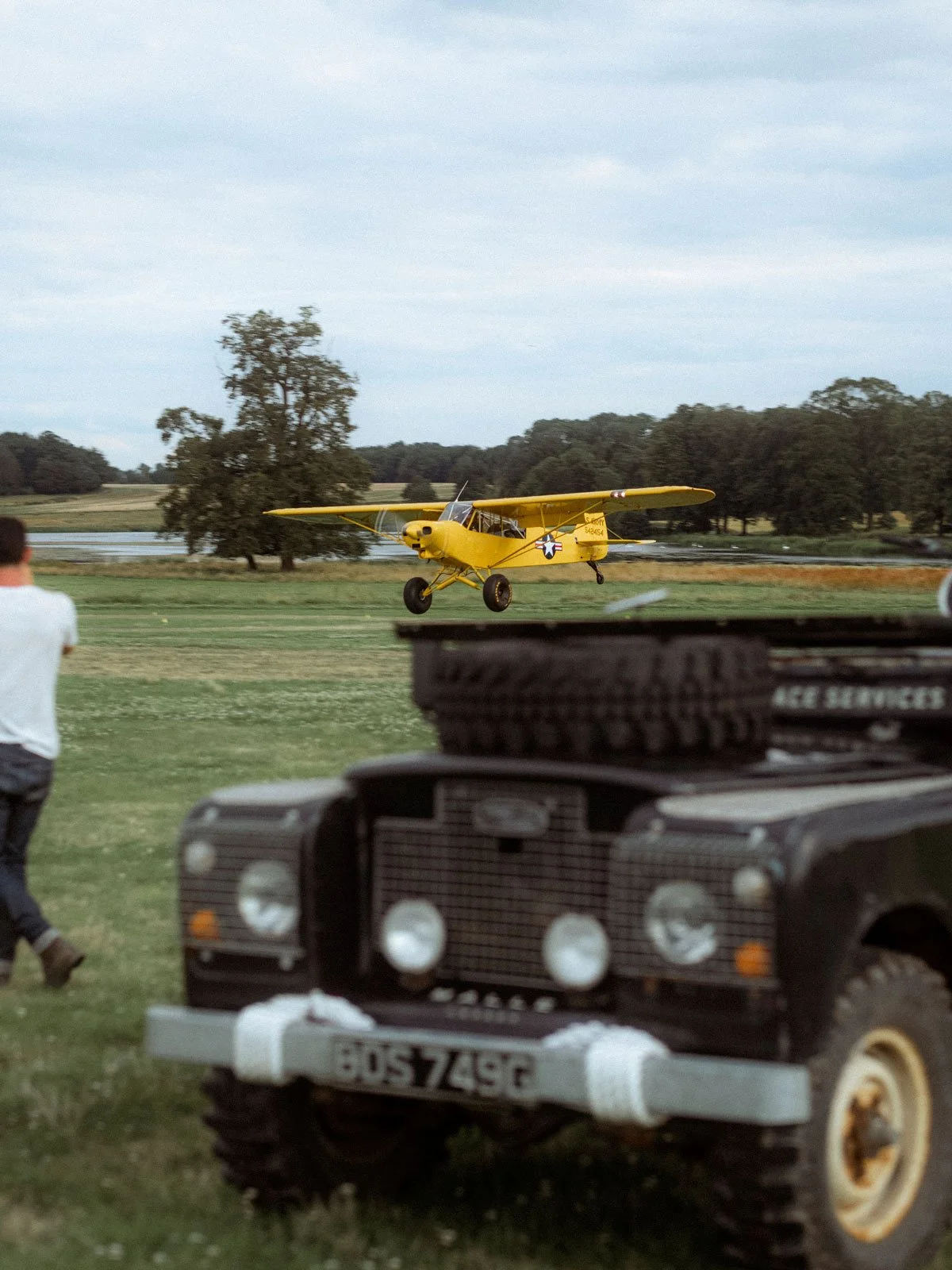 Piper PA-18-150 Super Cub landing off airfield using Alaskan Bushwheels.