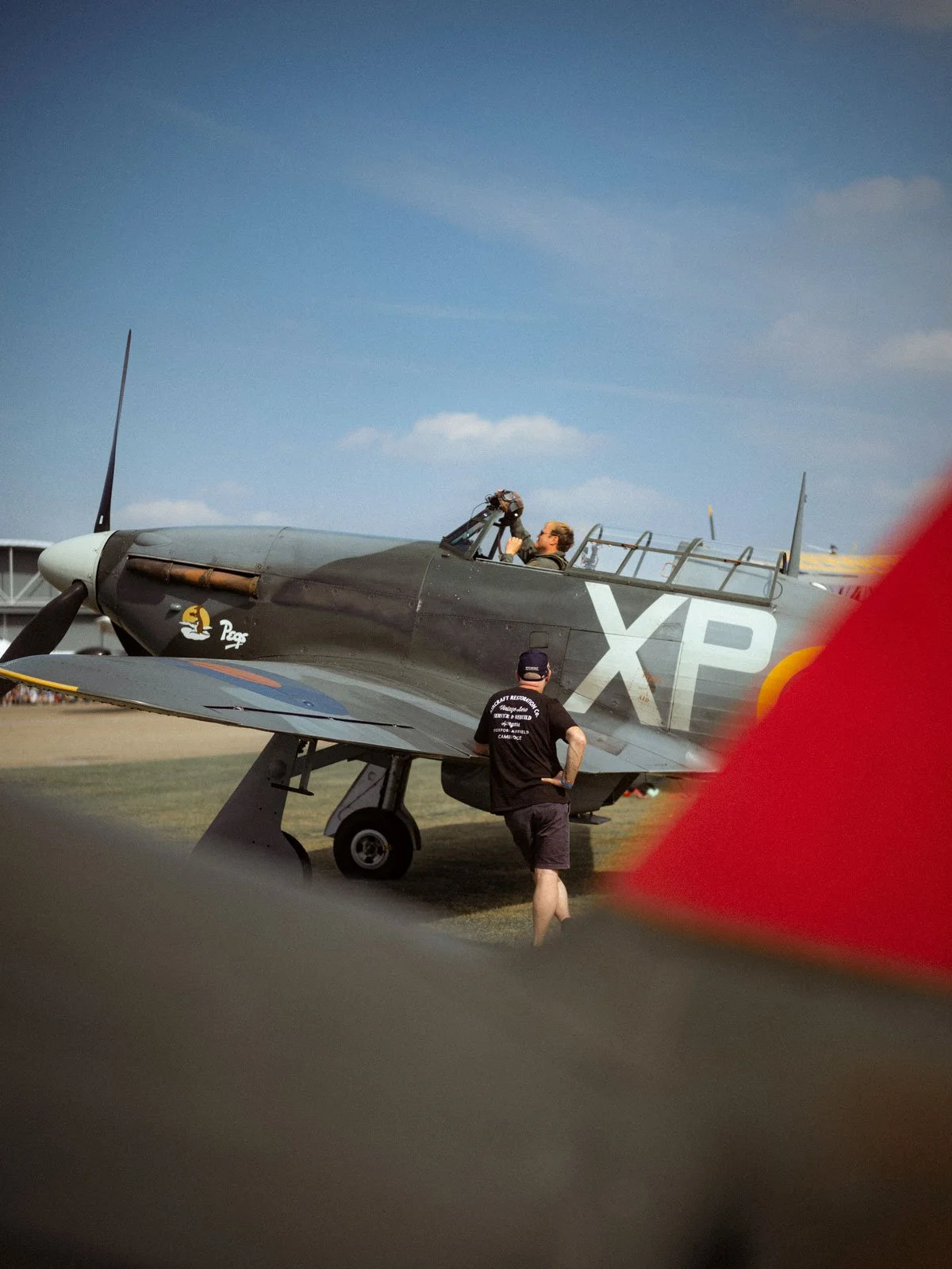 Hawker Hurricane IIB BE505 pilot and engineer flight prep at IWM Duxford Airfield Airshow.
