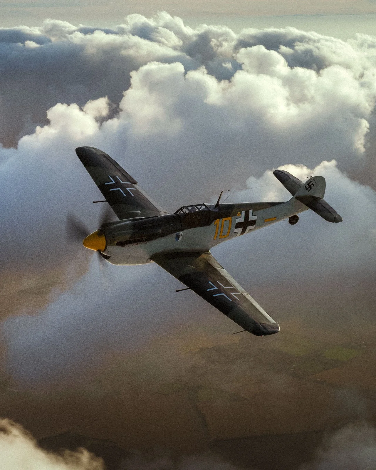 Hispano Aviación Buchón as Messerschmitt Bf-109 Yellow 10 banking left in dusky skies.