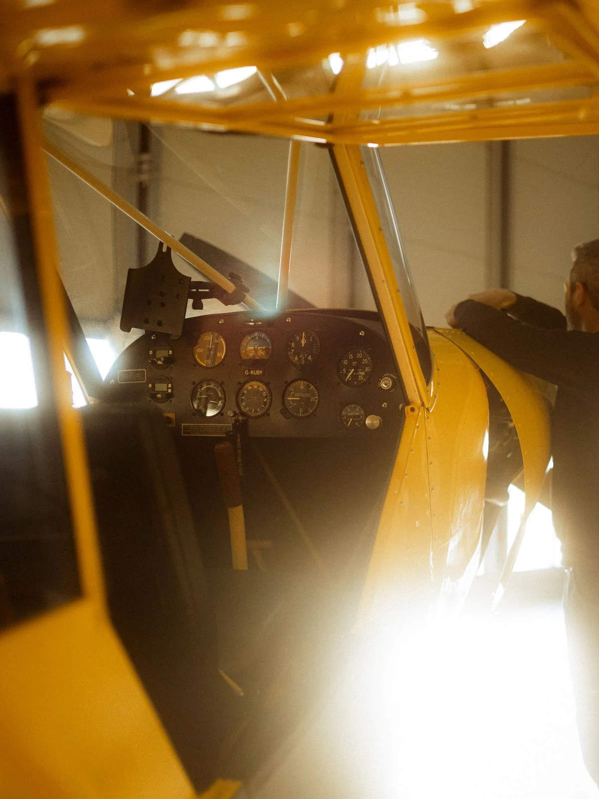 Piper PA-18-150 Super Cub in ARCo Maintenance Hangar - cockpit flying controls.