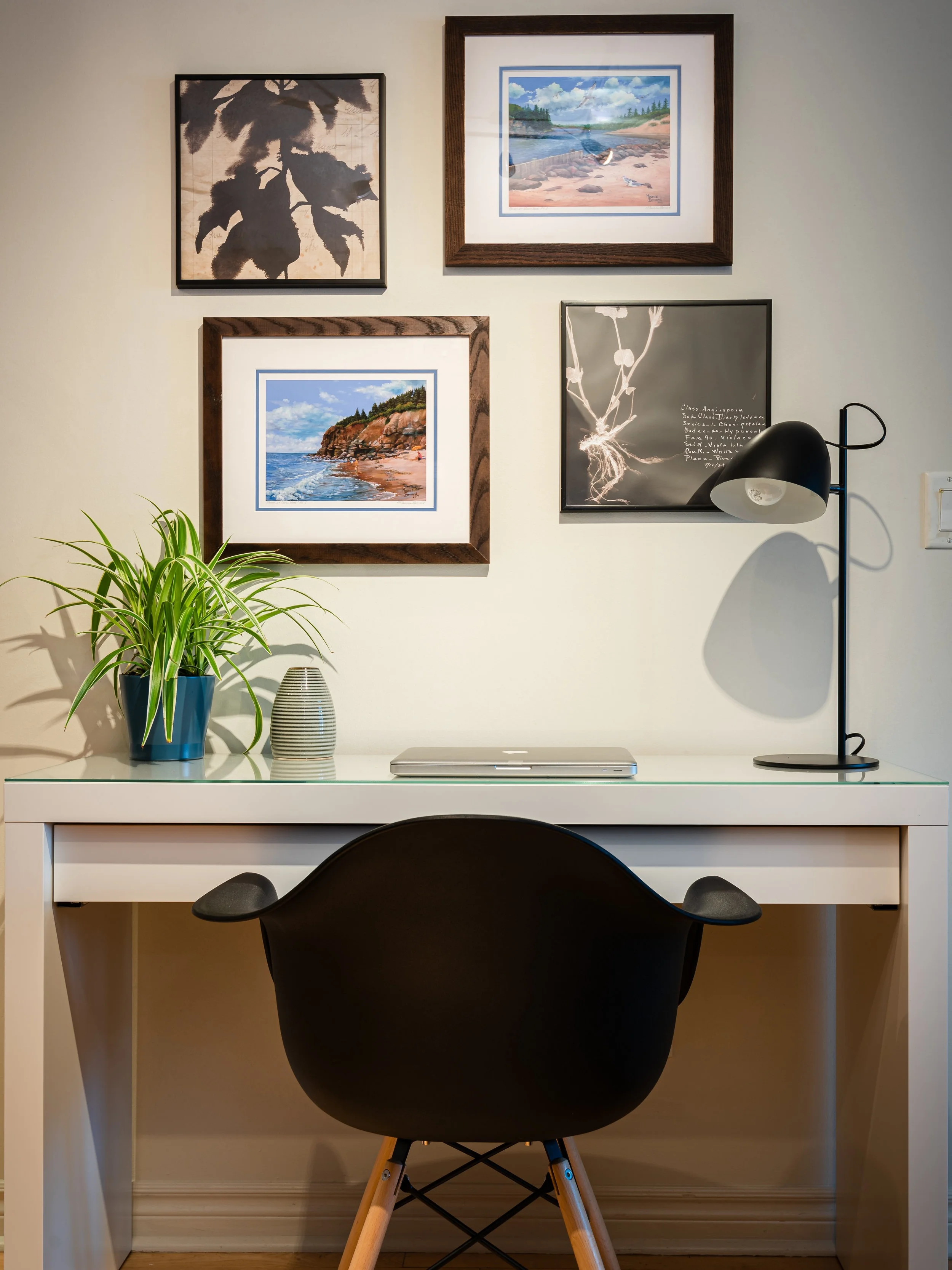 Joel replaced the chunky wooden cabinets with a sleek white desk. He kept the original artwork — a pair of sentimental paintings of Prince Edward Island where one of the contest winners is from — and added two new inexpensive pieces to create a mini gallery wall.
