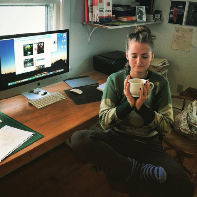 This is me in my home studio, sitting at the desk my late father made, blissed out on coffee and Camp Now!