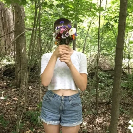 A self portrait I took in the woods using the timer button on my phone (and a convenient hole in a tree).