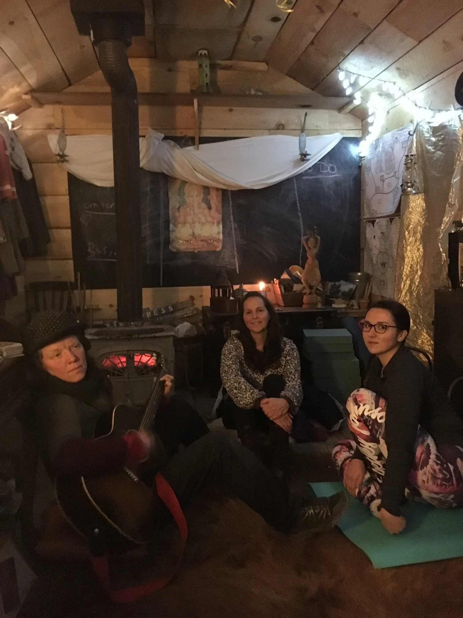 Maze giving my mother and I a concert in the cabin on the Camp Now Art Farm.