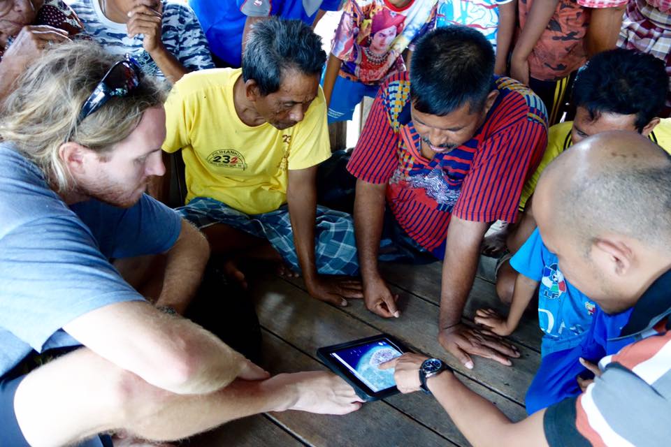  Austin asking fishers of Pulau Bontosua where they go to catch coral reef 'squid', or cuttlefish. 