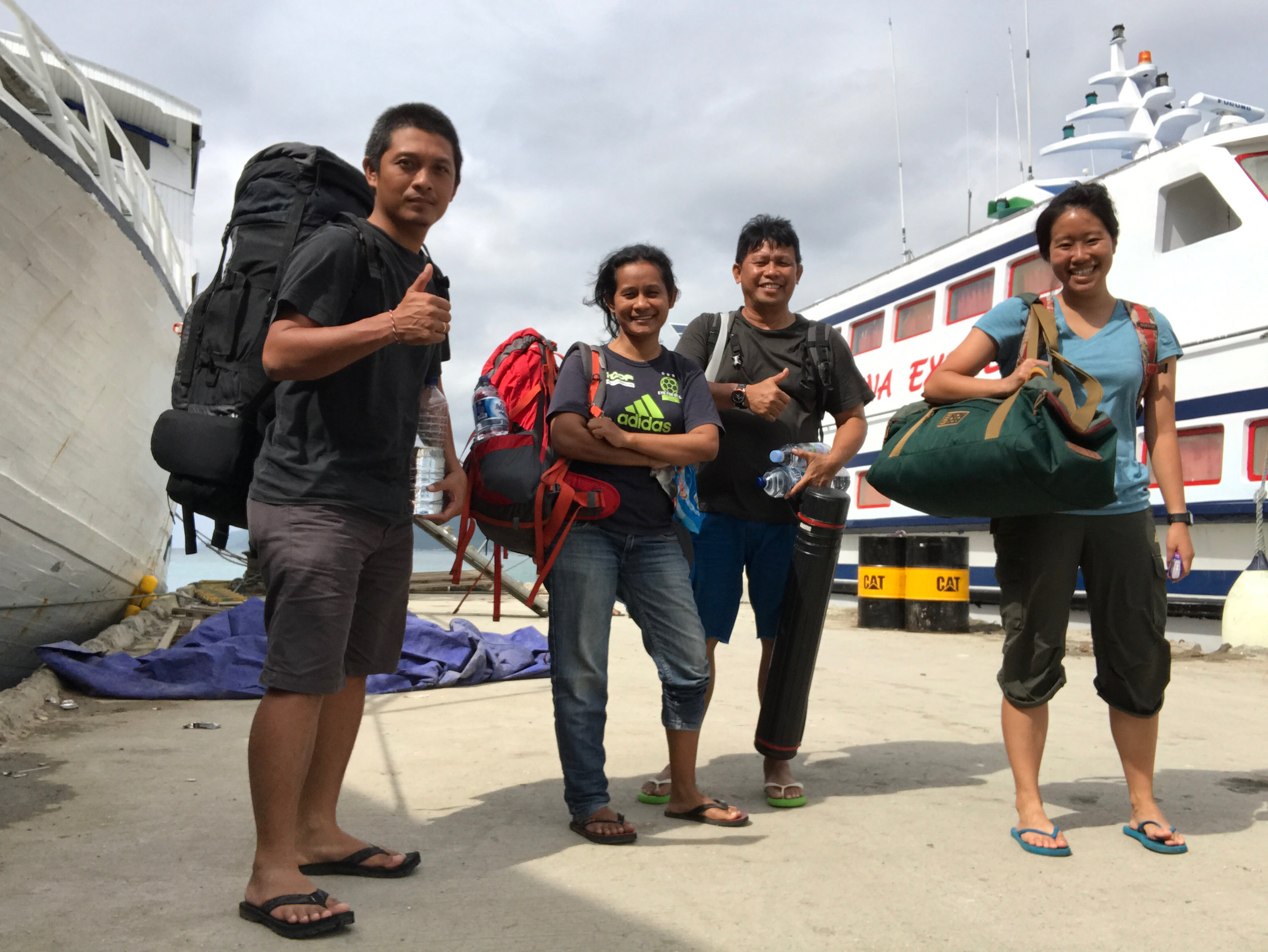 Elle (far right) on her travels to Kasuari village. It took three days of travel by air, land, and sea!