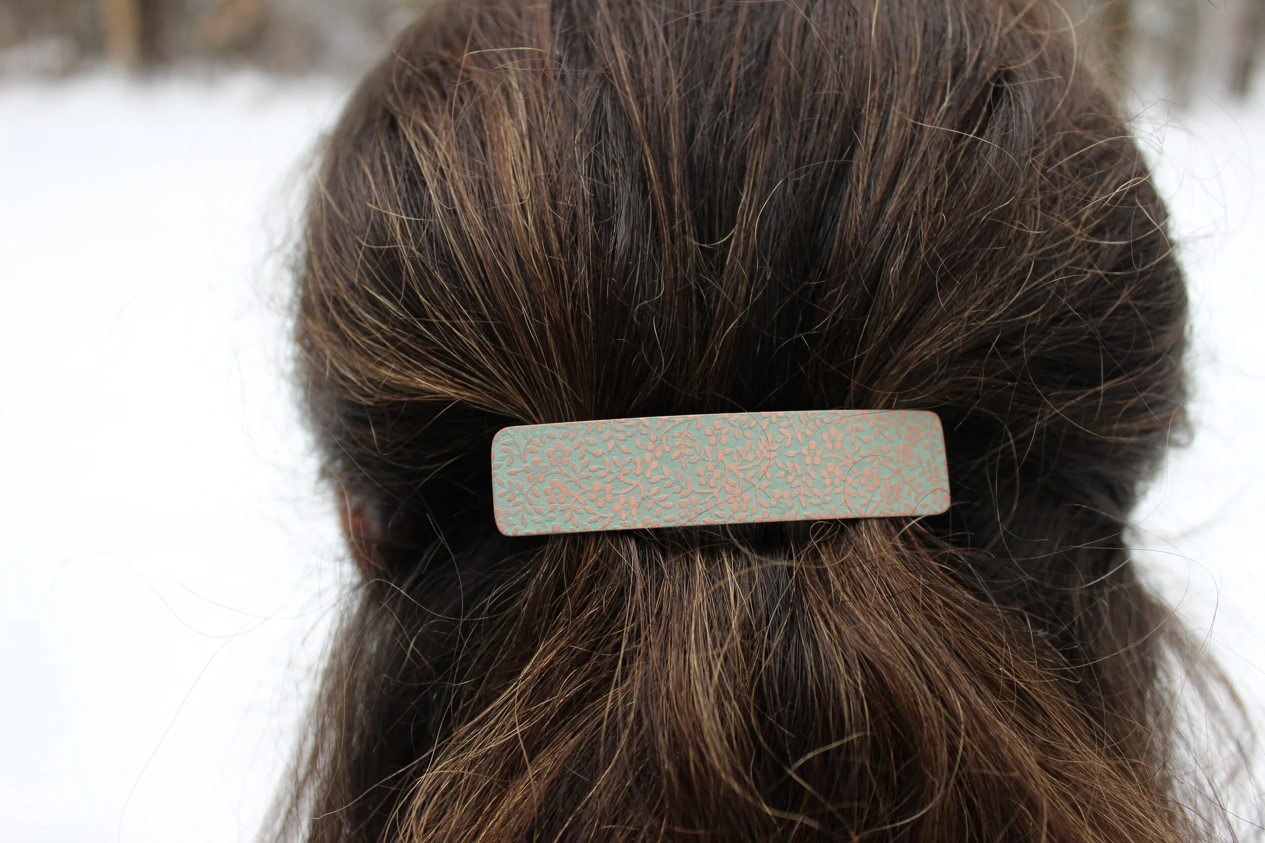 juniper green tiny flower in hair.JPG