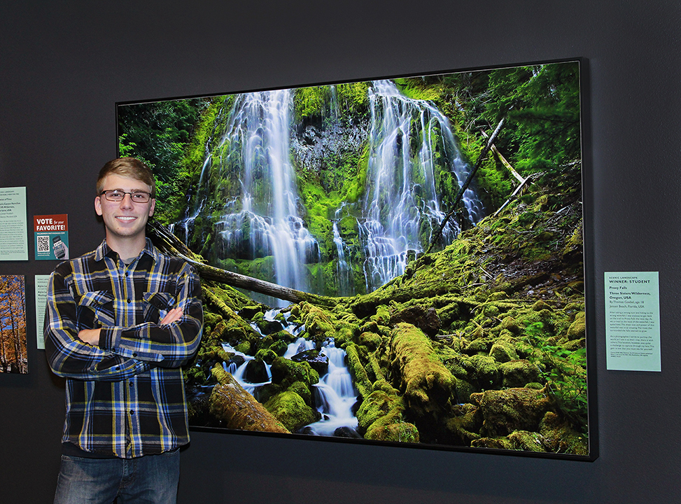  Thomas is pictured here in the Smithsonian Museum next to his highly awarded and collected image “Mystic Falls”  