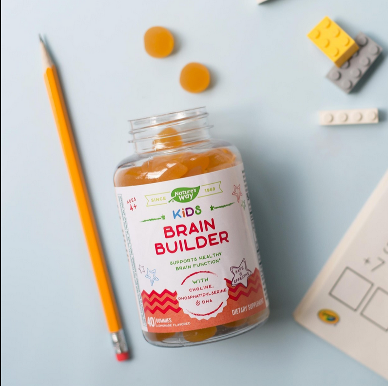 Childrens Vitamin Bottle tipped over on a desktop