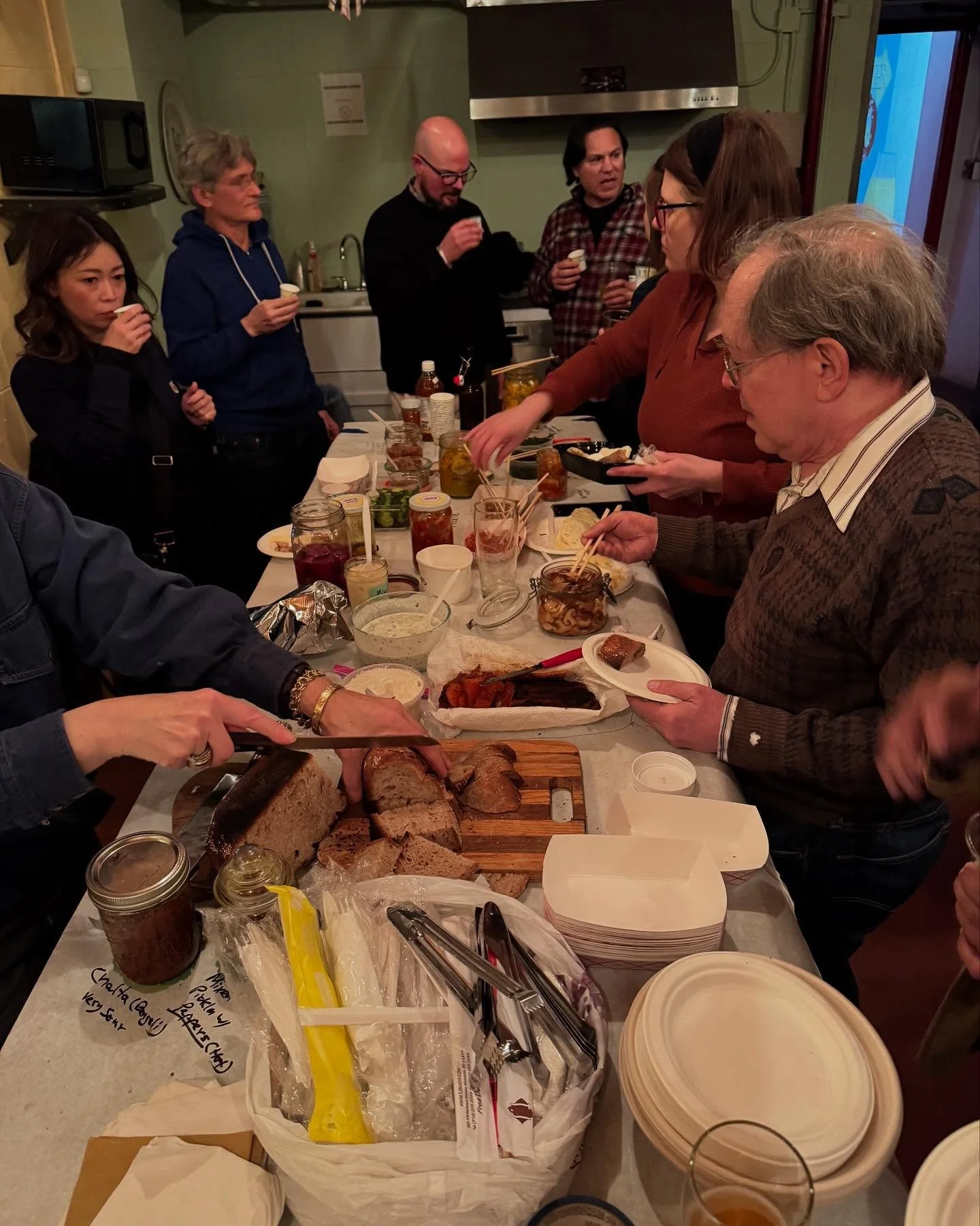 A gathering of fermenters showcasing fermented flavors.