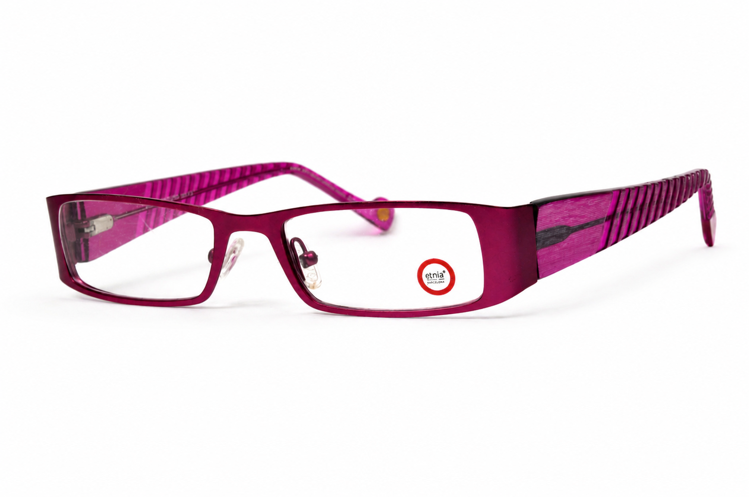 Magenta eyeglasses with patterned temples.png
