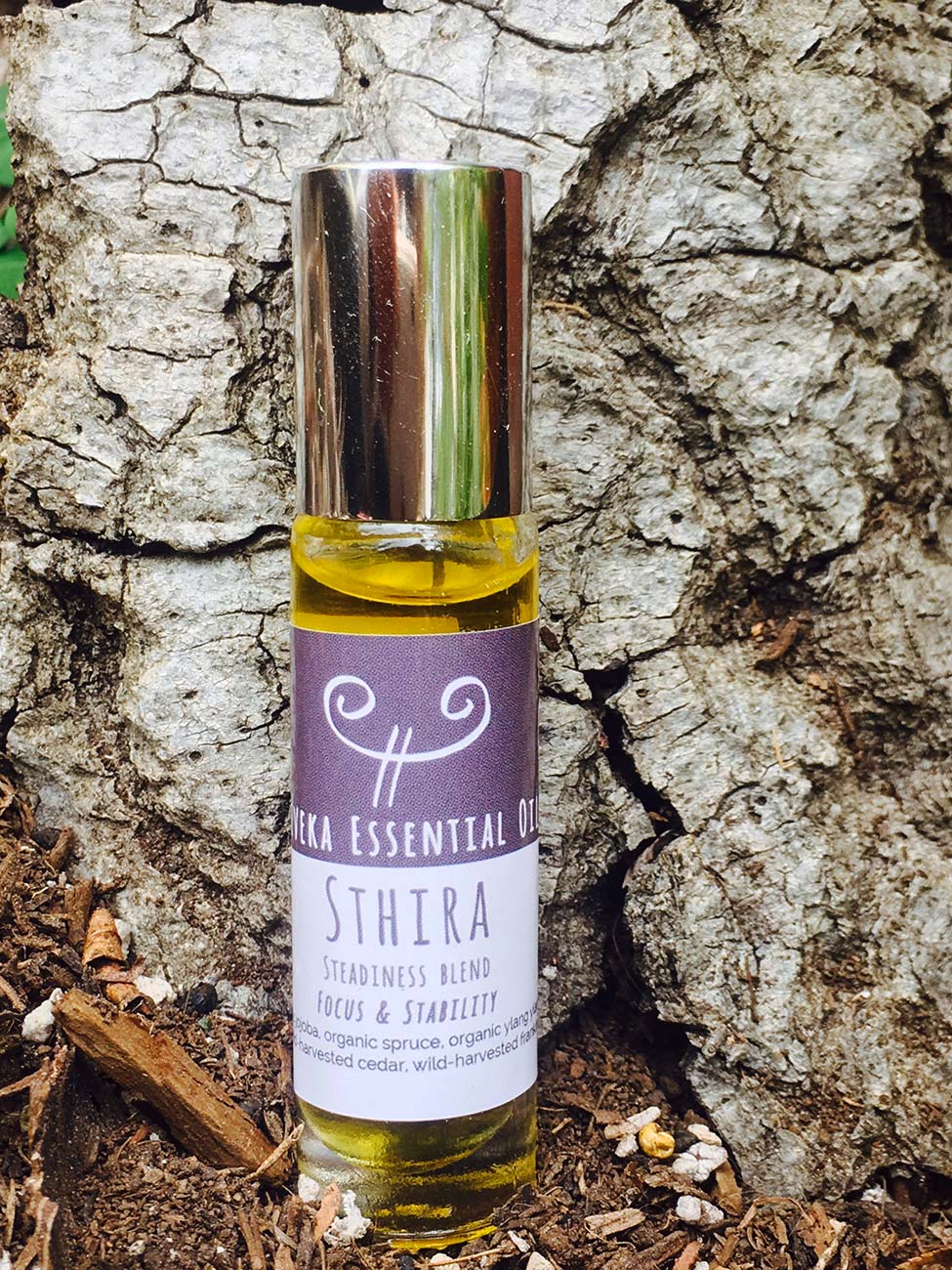 STHIRA STEADINESS BLEND Spruce Oil (Canada, organic): purifying & cleansing, dispels mental fatigue & stress. Promotes clarity of mind, steadiness & helps overcome sadness. Ylang-Ylang Oil (Madagascar, organic): raises the spirit & opens the heart, grounds & stabilizes, soothing to body & mind, boosts self-esteem Silver Fir (Bosnia, organic): warming, promotes mental clarity, boosts energy, soothing to joint & muscles. Cedar Oil (India, wild-harvested): calming & grounding properties, promotes emotional equilibrium, stimulating to the body & calming to the mind. Frankincense Oil (India, wild-harvested): uplifting & clarifying, provides protection, life-force activating, helps the body stay limber and relaxed. Carrier Oil: Jojoba Oil, organic, unrefined & cold pressed