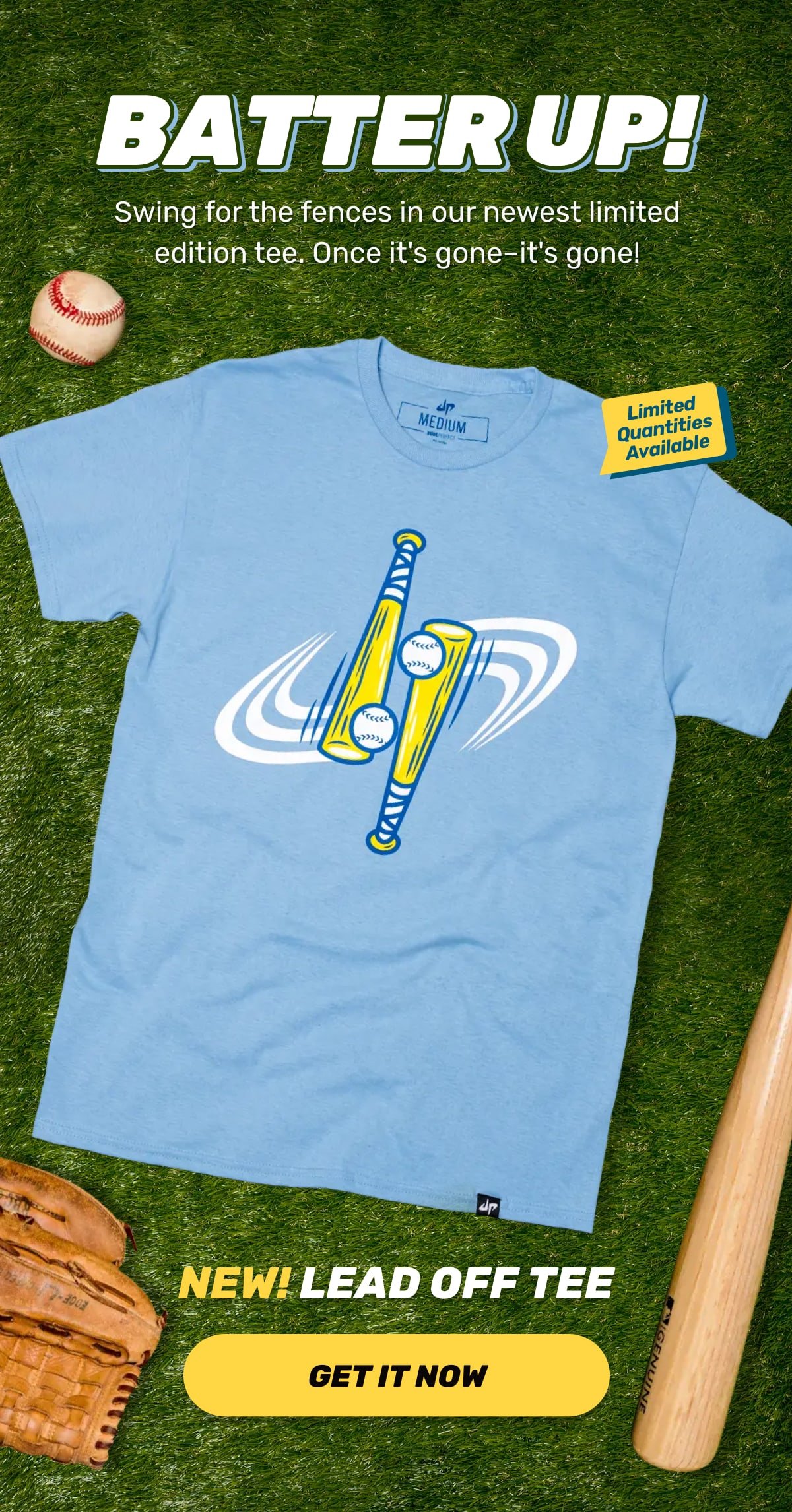 Promotional image for a baseball-themed t-shirt. The shirt is light blue with a design of two yellow baseball bats and two baseballs in motion. Text reads "Batter Up!" and offers a limited edition tee. Accessories shown include a baseball, glove, and