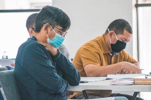 Two-Men-With-Masks-Studying.jpg