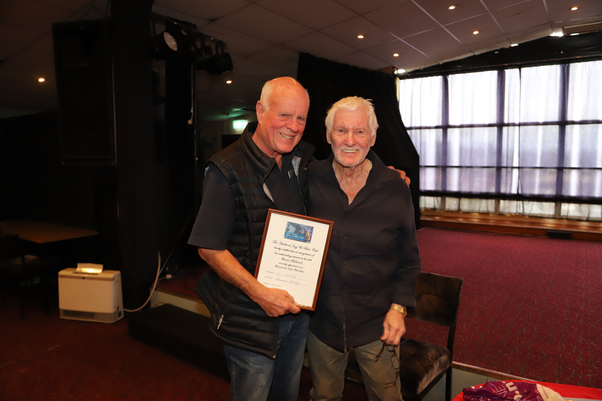Bruce Hilliard being presented with Life Membership by Mike Walker, President. 