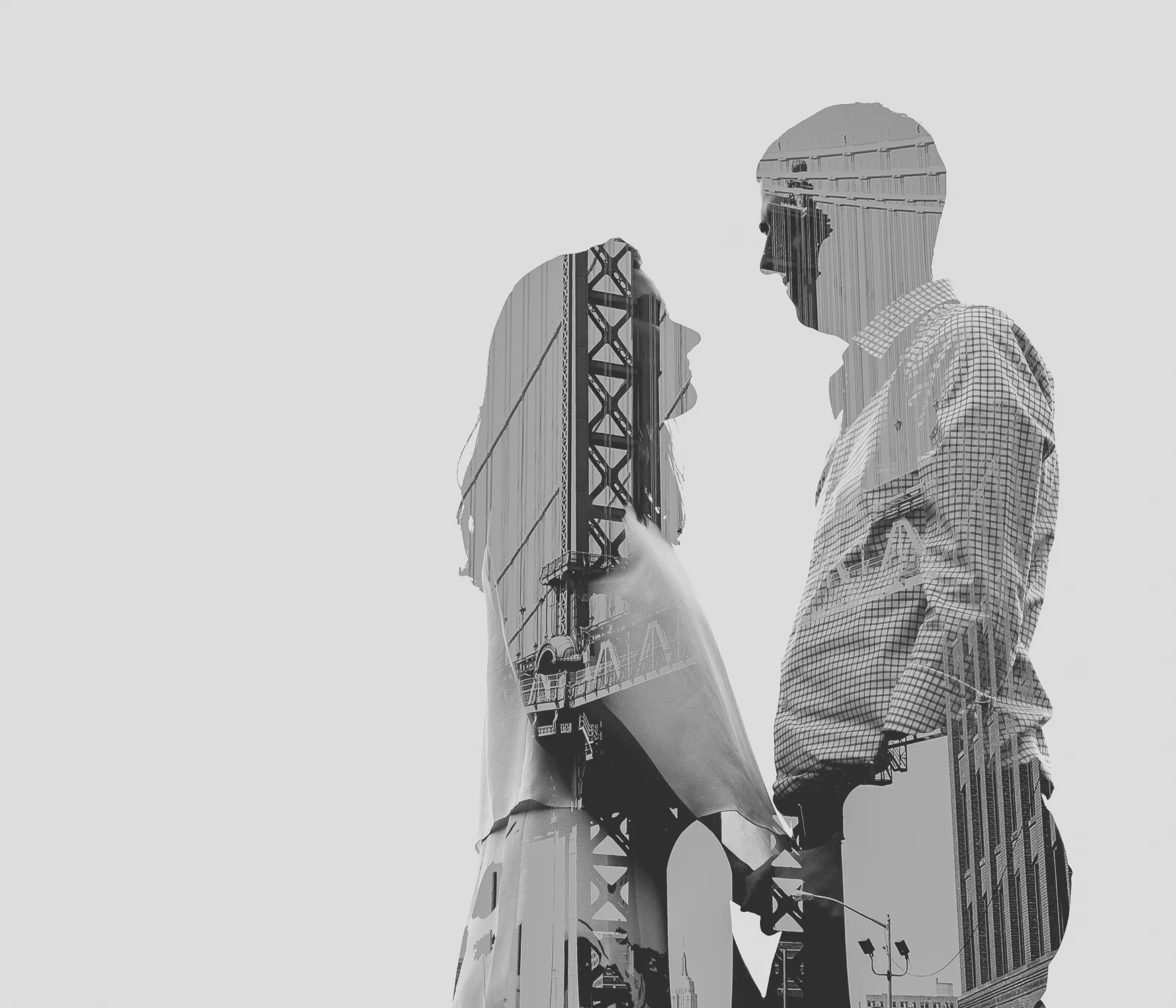 Fun double exposure of couple and Manhattan Bridge, Brooklyn, NY