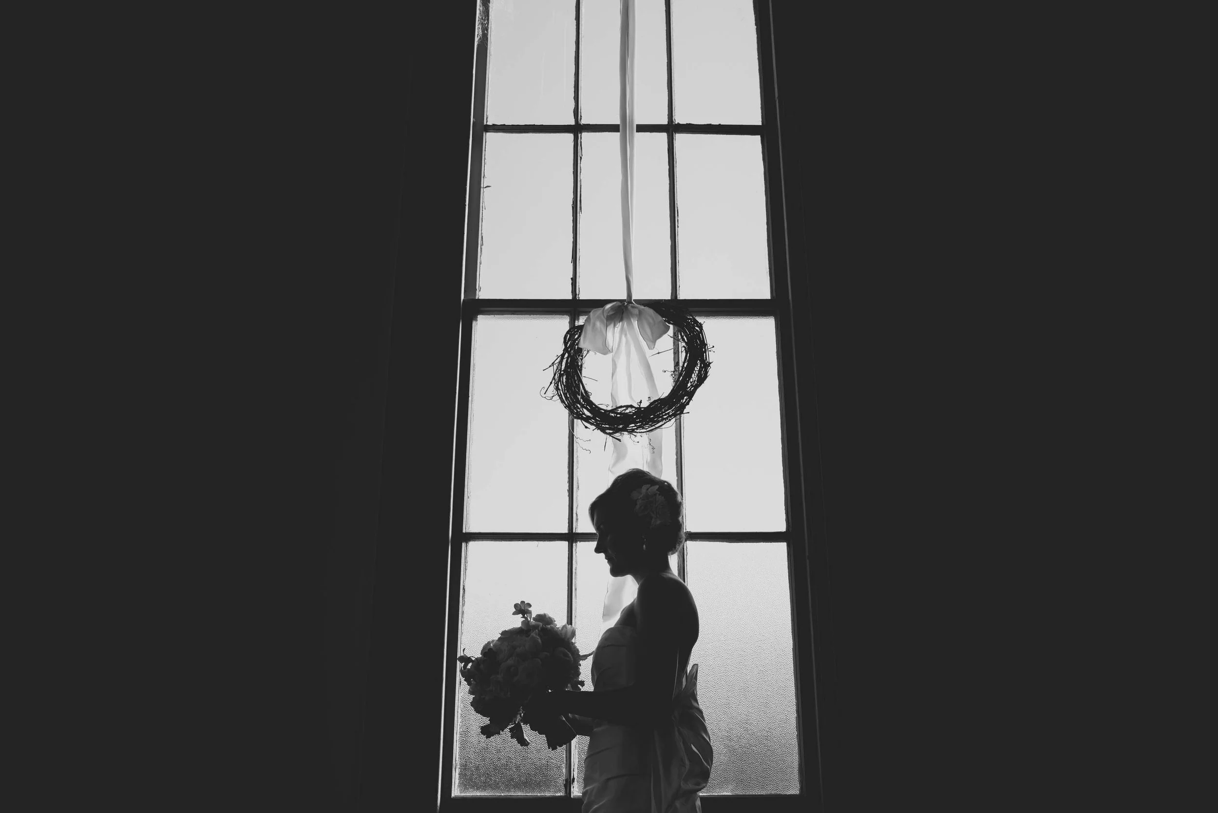Bridal portrait in the window of The Chapel Between Cotton and Gin, Greensville, NC