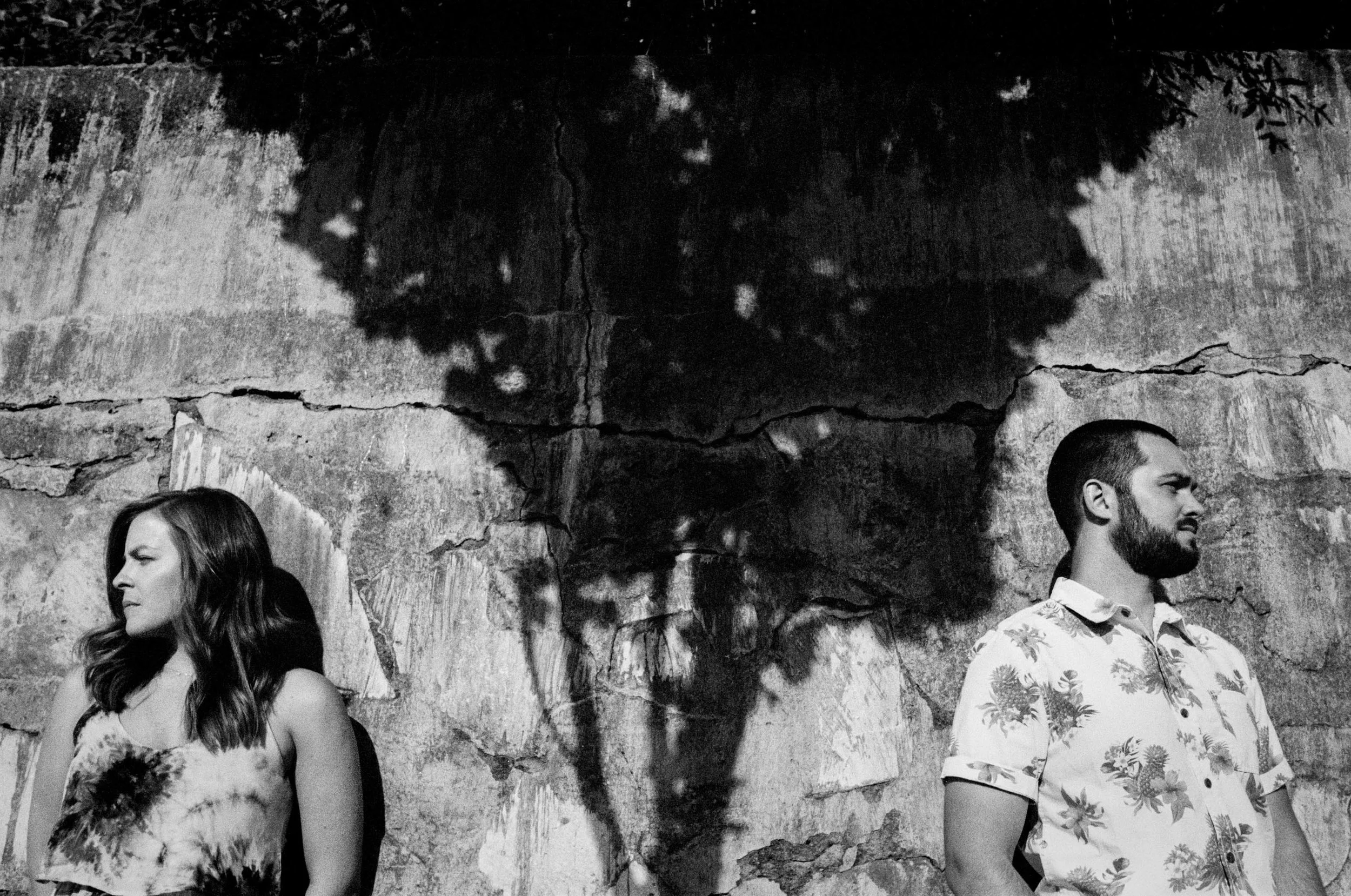 Couple split by Tree Shadow on Concrete Wall, Wilmington, NC