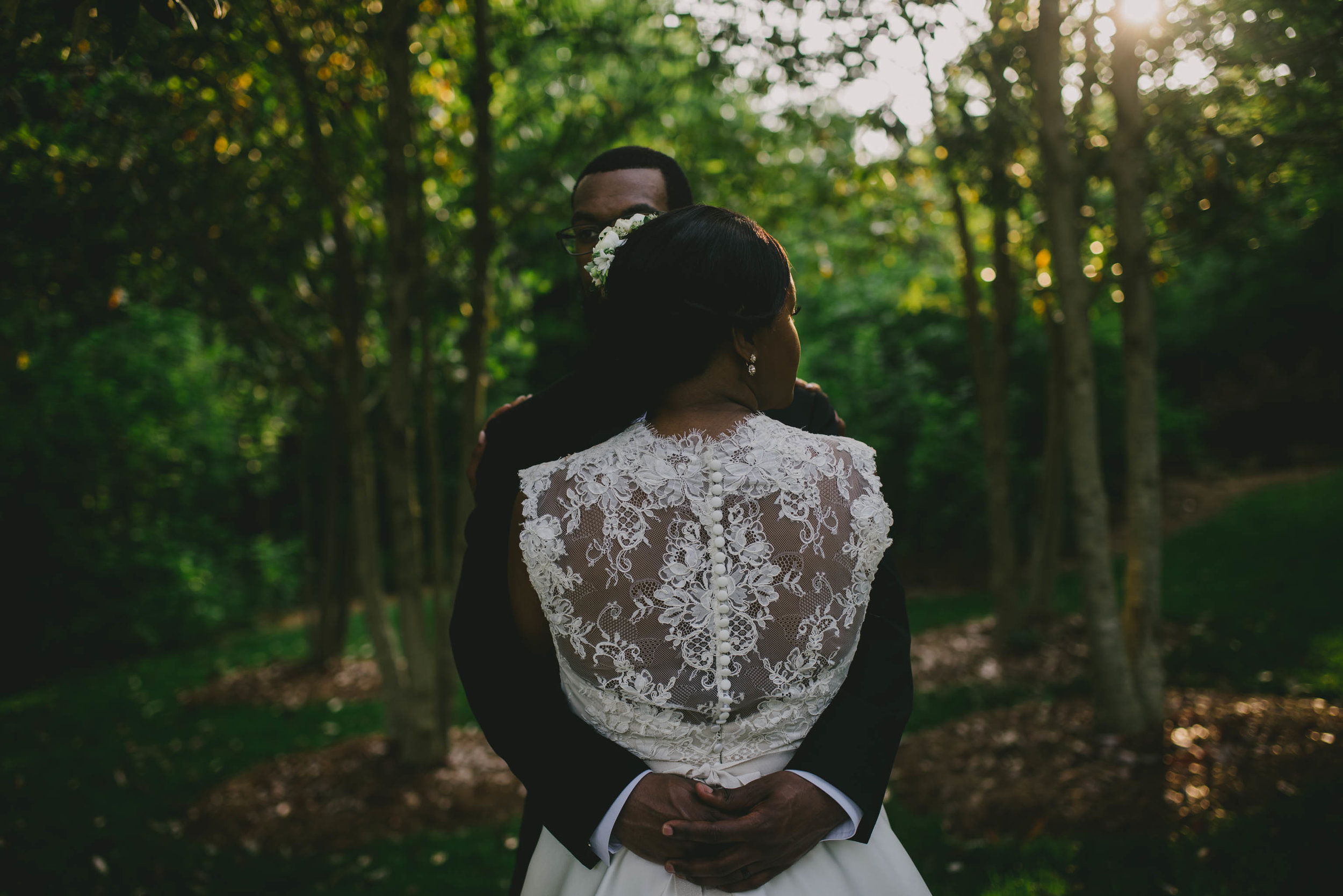 The bride and groom embrace for photos aft their elegant wedding at the Umstead Hotel and Spa in Cary, NC