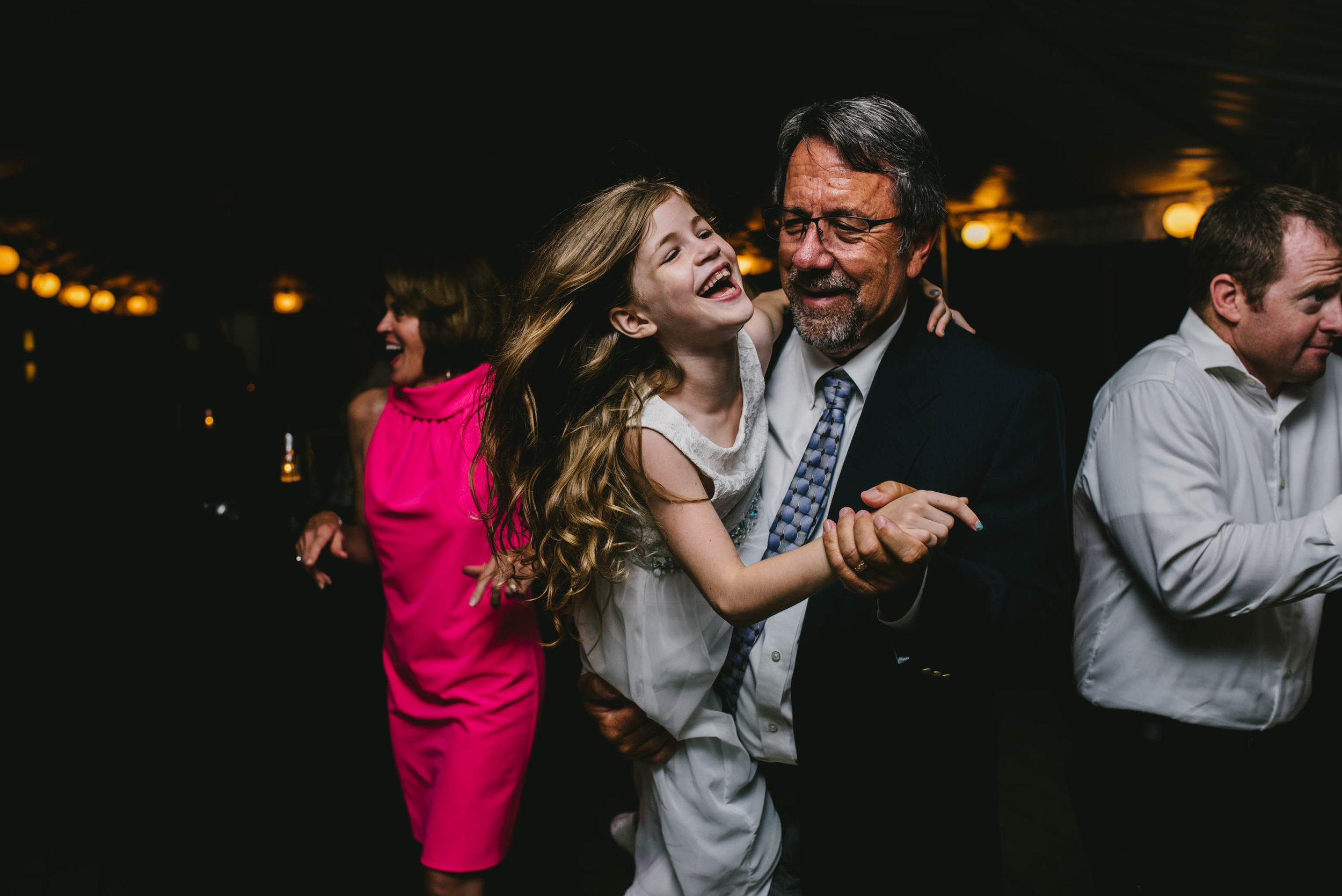 flower girl dancing with wedding guest at this Jiddi Space and Courtyard Wedding at Sitti Restaurant