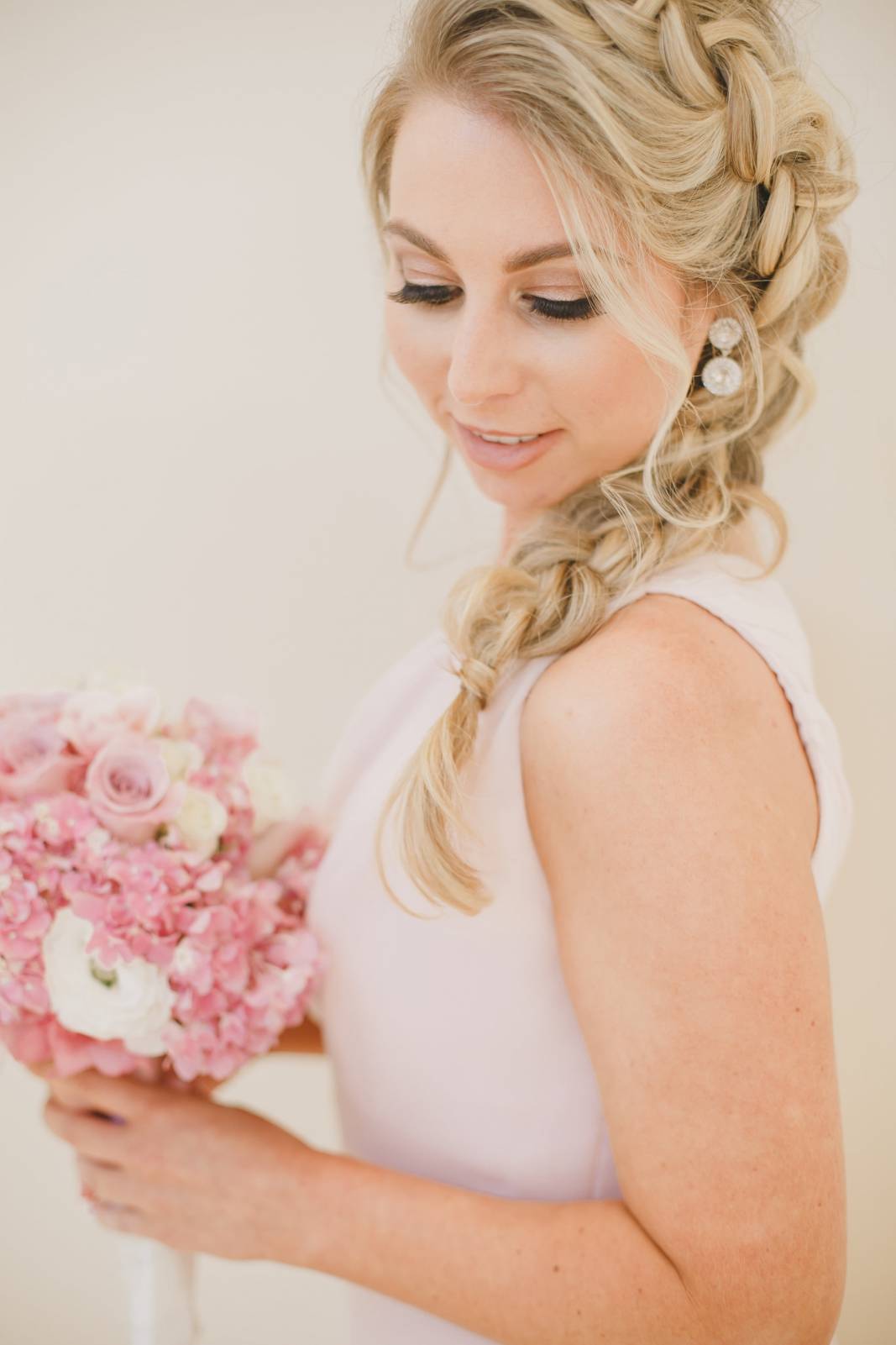 This is a very popular look this year. They loosely braid the hair and then the trick is to pull the hair even looser even with a few pieces falling out.