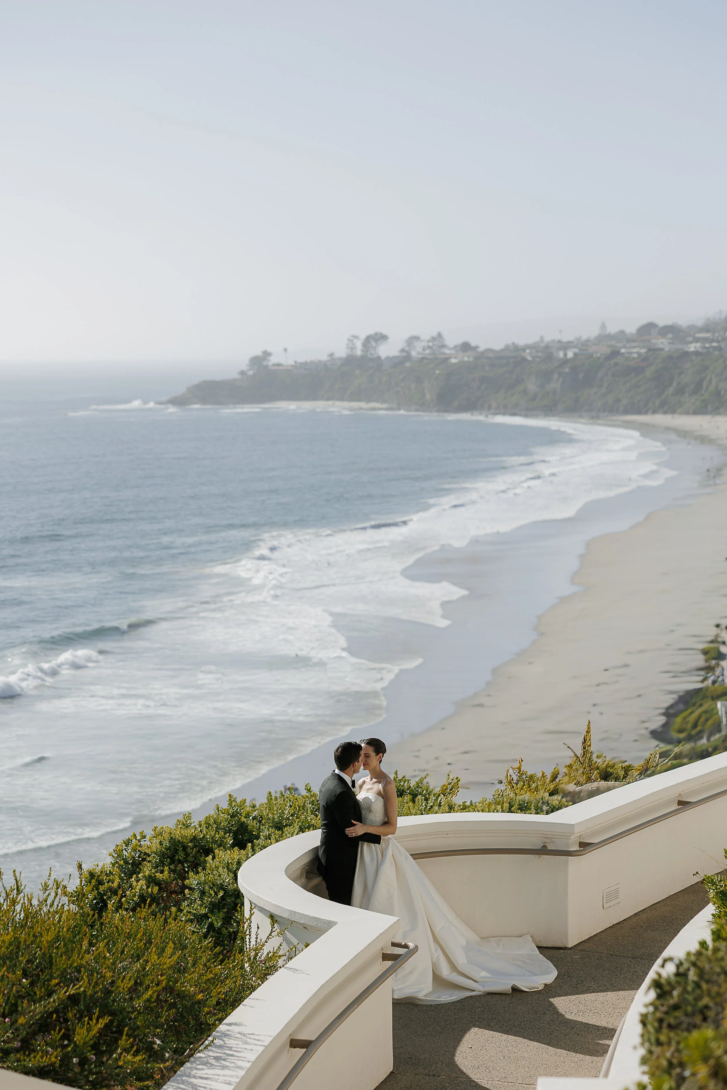 Bride getting finished hair and makeup touch-ups at Ritz-Carlton Laguna Niguel