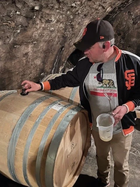 Alexandre Le Brun tasting the vin clair in Champagne from barrel