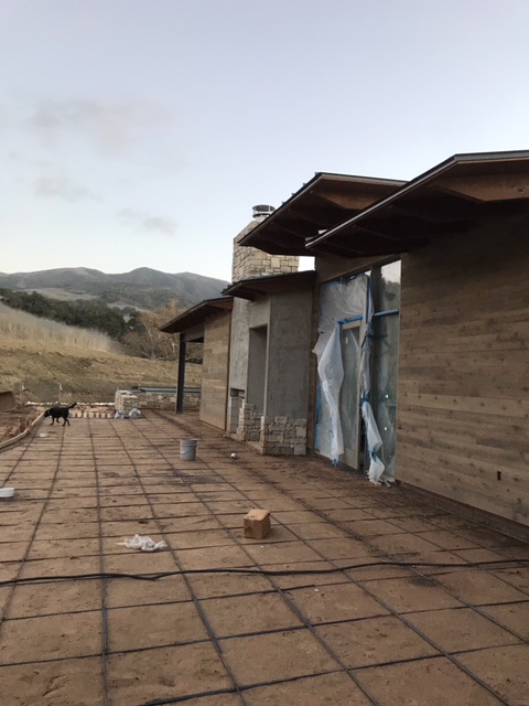 To the right - the beginnings of a cozy fireplace.