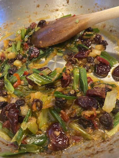 Agroducle ramps with pine nuts, whipped ricotta, plumped currants and toasted bread.