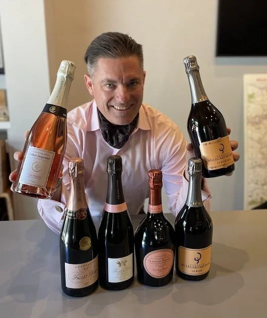 K&L Wine Merchants Expert in Champagne, Gary Westby, holding Champagne bottles