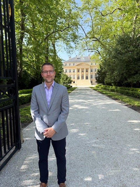 Bordeaux Expert Ryan Moses in front of Chateau Margaux in Bordeaux during the 2025 En Premieur Campaign
