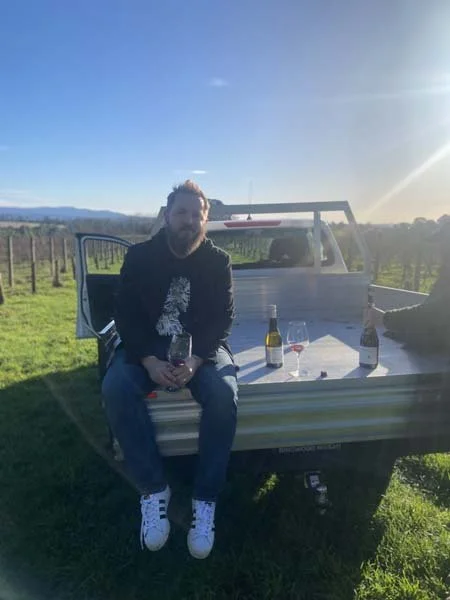 K&L Wine Merchants' Australian Wine Buyer Thomas Smith in a pick up truck at Oakridge's Henk Vineyard