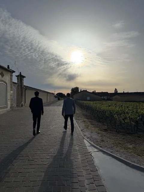 Wine experts at a chateau in Bordeaux at sunset