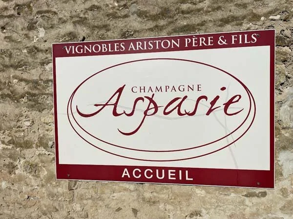 A picture of the label/signage from Champagne Ariston Aspasie, available at K&L Wine Merchants.