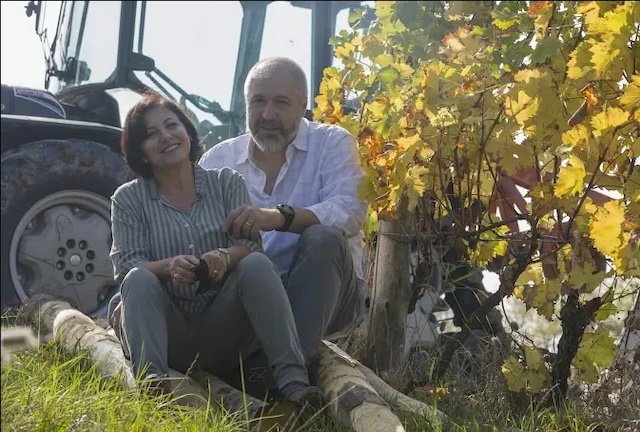 Winemakers at Vigneti Repetto in Piedmont sitting among their vineyards. Wines available at K&L Wine Merchants.