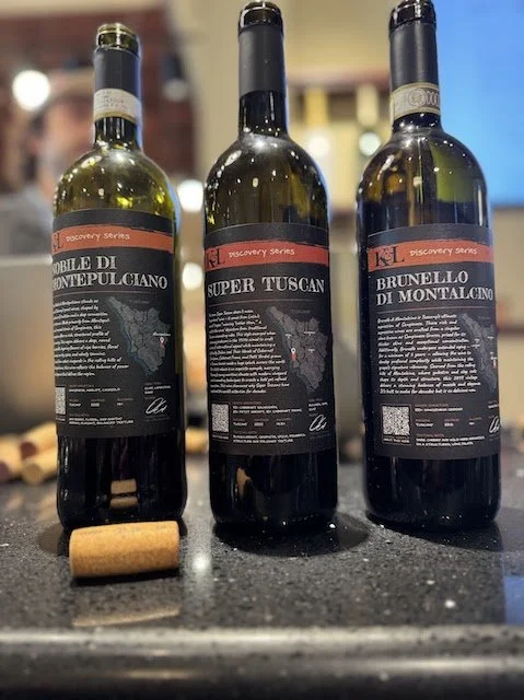Italian red wine bottles including Brunello di Montalcino, Vino Nobile di Montepulciano, and Super Tuscan wine
