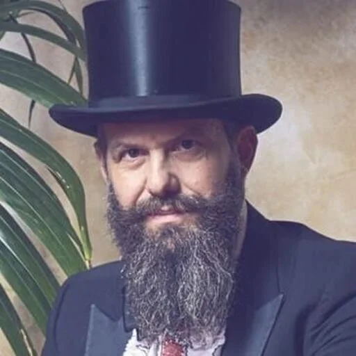 Vintage‑style portrait of a spirits expert Josh Gelfand featured in an article on Italian spritz cocktails